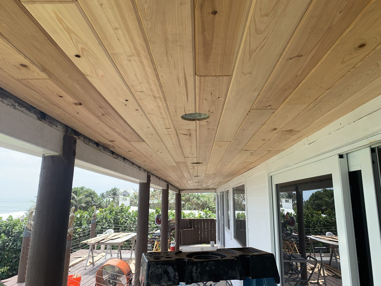 Cypress plank ceiling installed on an oceanfront covered porch