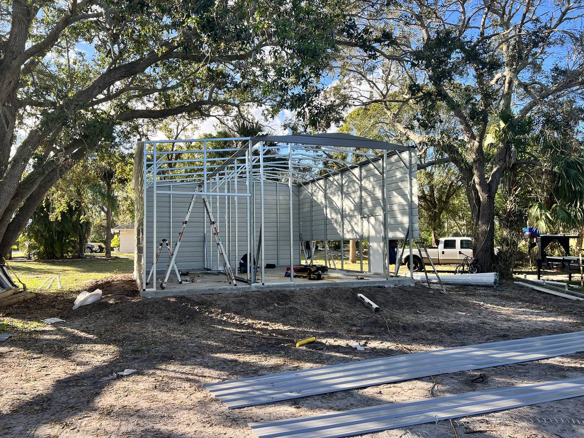 Steel frame standing on a new slab for a metal garage building