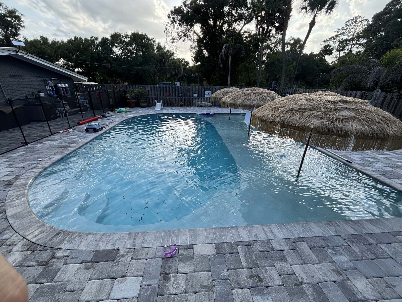 Paver pool deck laid tight with a contrasting border course
