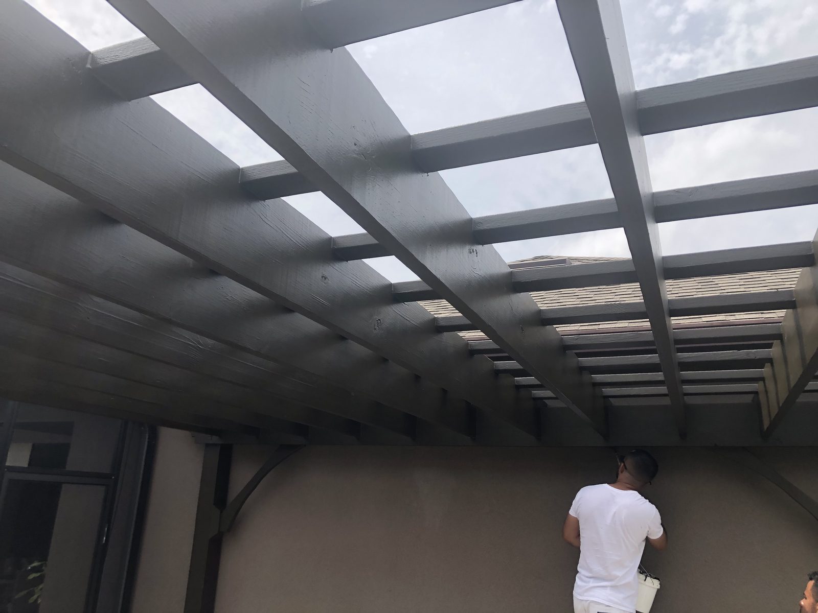 Finished painted pergola rafters seen from below