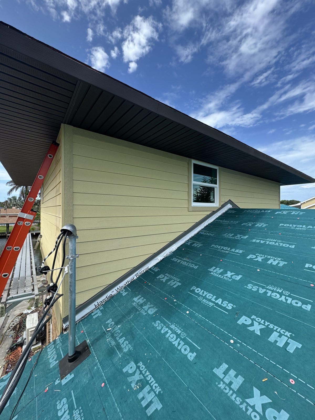 Peel-and-stick underlayment dried in against new lap siding and fascia