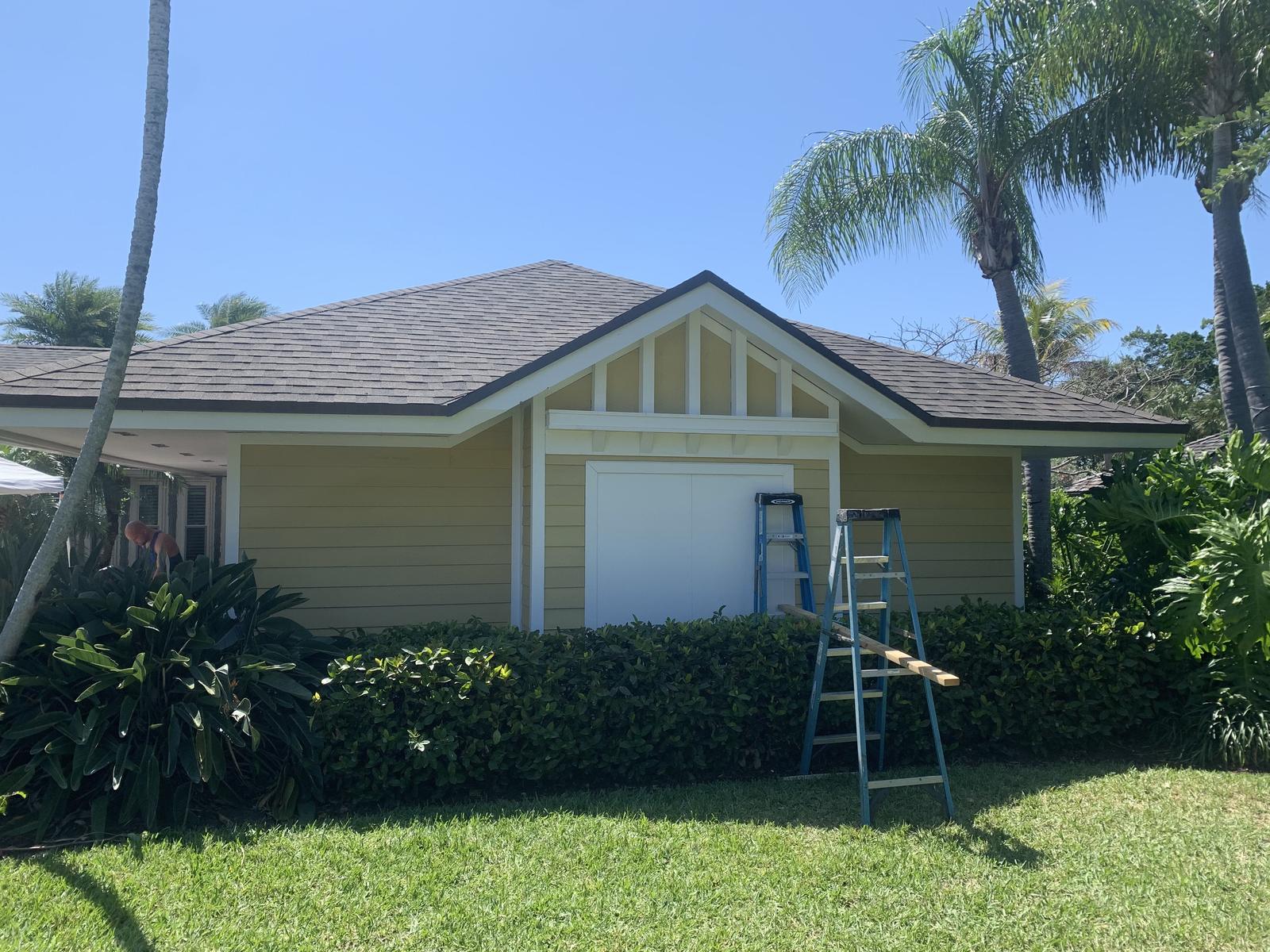 Lap siding with a gable truss detail and bracket trim on a Florida ranch